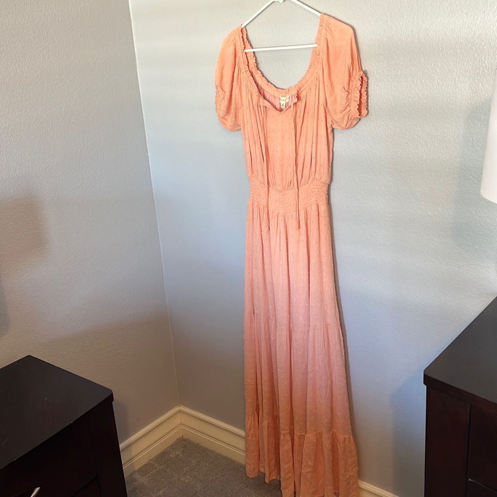 Never worn dress . Only tried on. Maxi style with defined waist . Tiered .